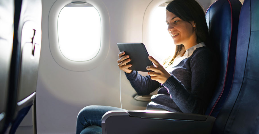 Passenger-with-Tablet-910 Airline Passenger with Tablet
